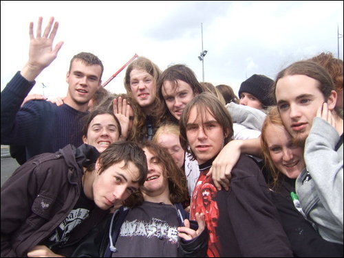 The group photo mentioned below, shows a bunch of white teenagers gathered in a group outside