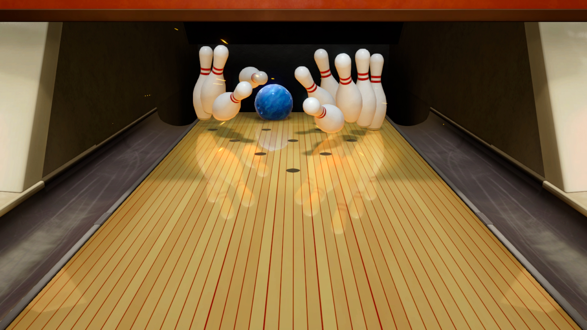 A blue bowling ball hitting pins right down the middle of the lane