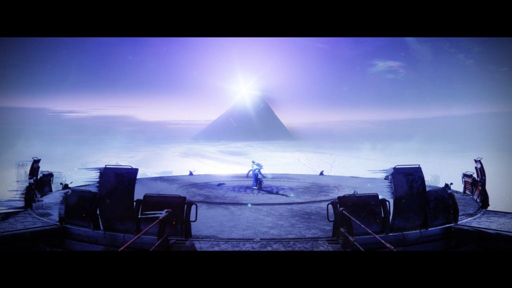 A pyramid rising out of periwinkle fog, with white light coming out of the top. A person is standing on a platform looking out over it.