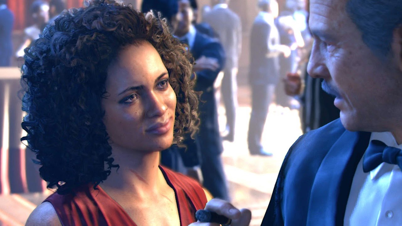 Uncharted's Nadine Ross, a black woman, speaking to a man in a suit. The shot is close on them so not much background is visible