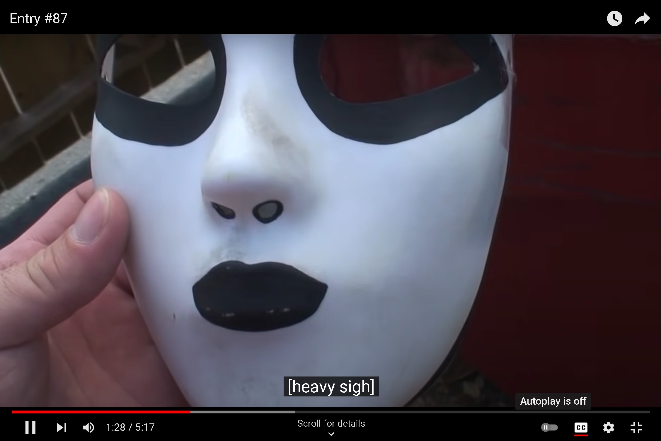 Screencap of Marble Hornets Entry #87 where someone behind the camera is throwing away a black and white mask