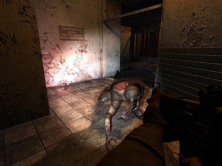 Stalker screenshot of a flashlight shining on a humanoid figure on the tile floor of a bathroom. They're wearing a gas mask
