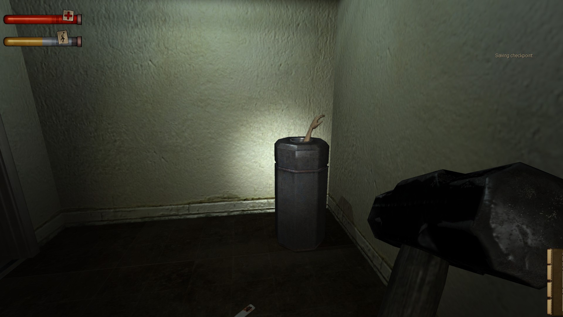 Screenshot of a trash can with a mannequin arm sticking out of it