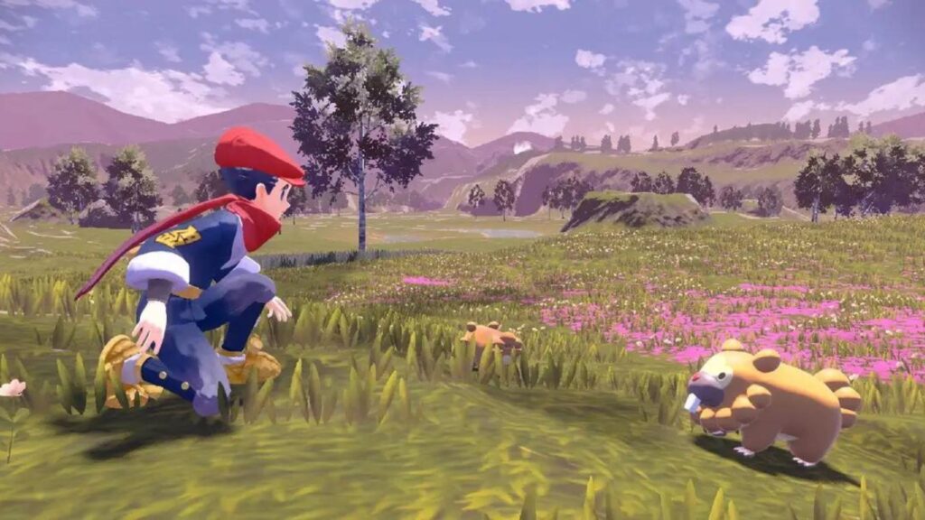 Pokémon Legends Arceus screenshot of the player kneeling down next to a bidoof in a field of flowers